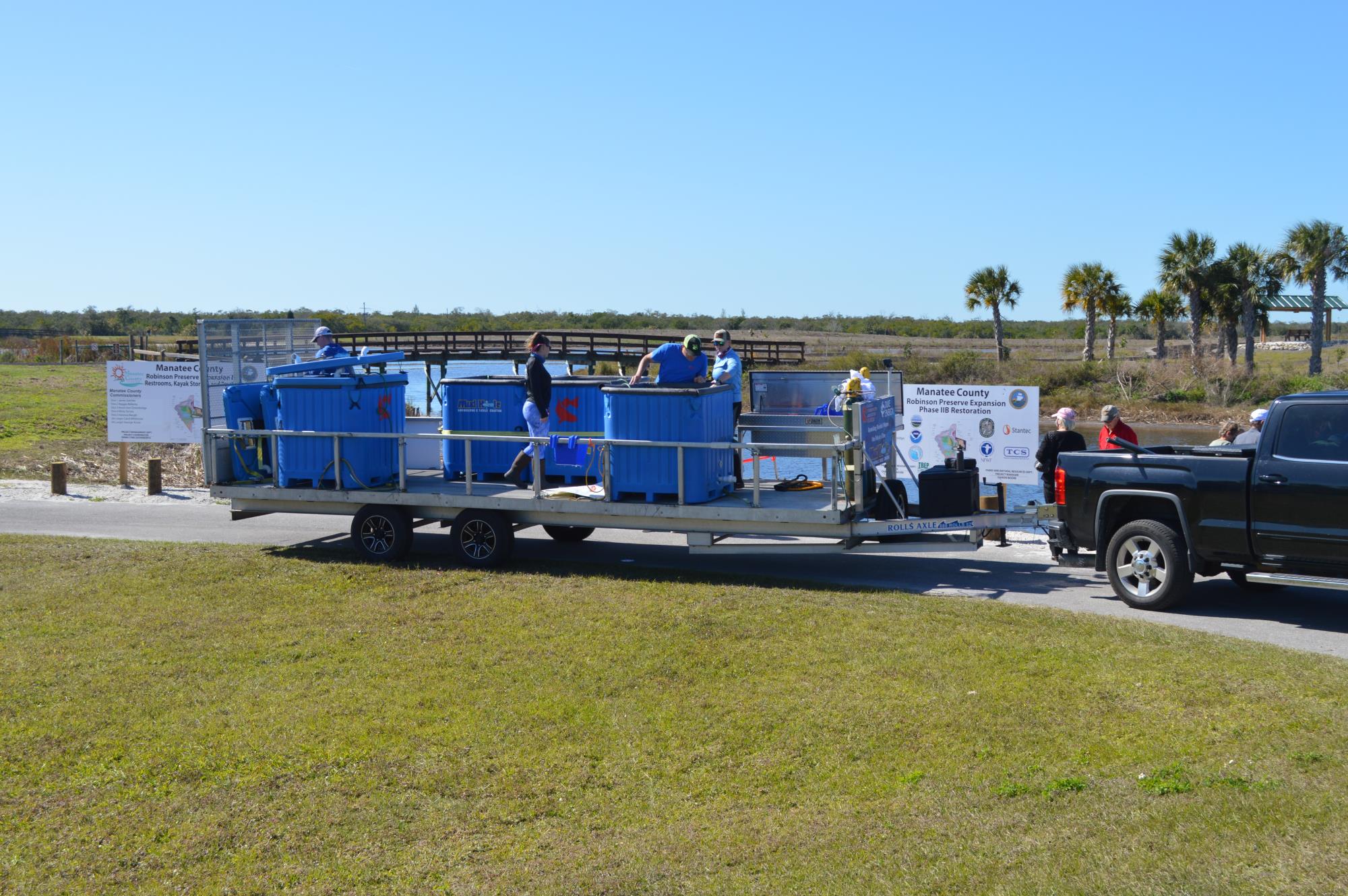 Duke Energy Truck holding fish to release 