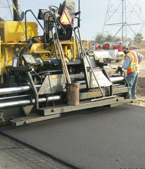 photo of road crews leveling asphalt